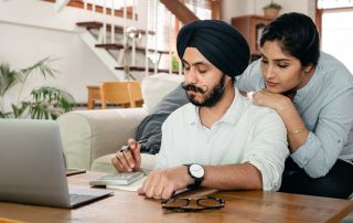 Photo of Couple performing Year End Tax Planning for Parents